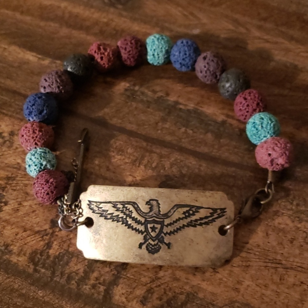 Gold tone Thunderbird medallion beaded multicolored bracelet